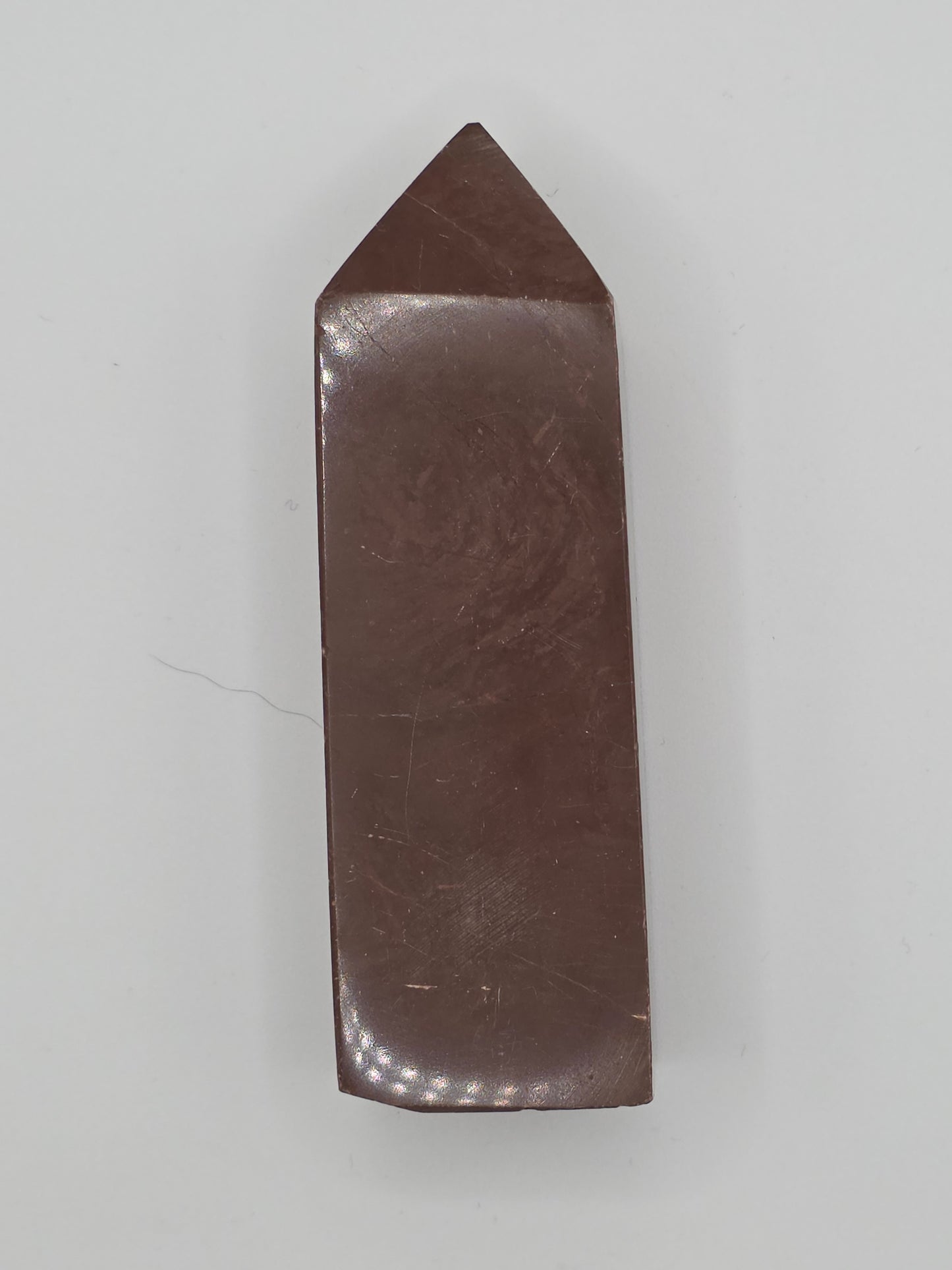 Angled view of Chocolate Jasper tower showing smooth surface and natural earthy patterns.