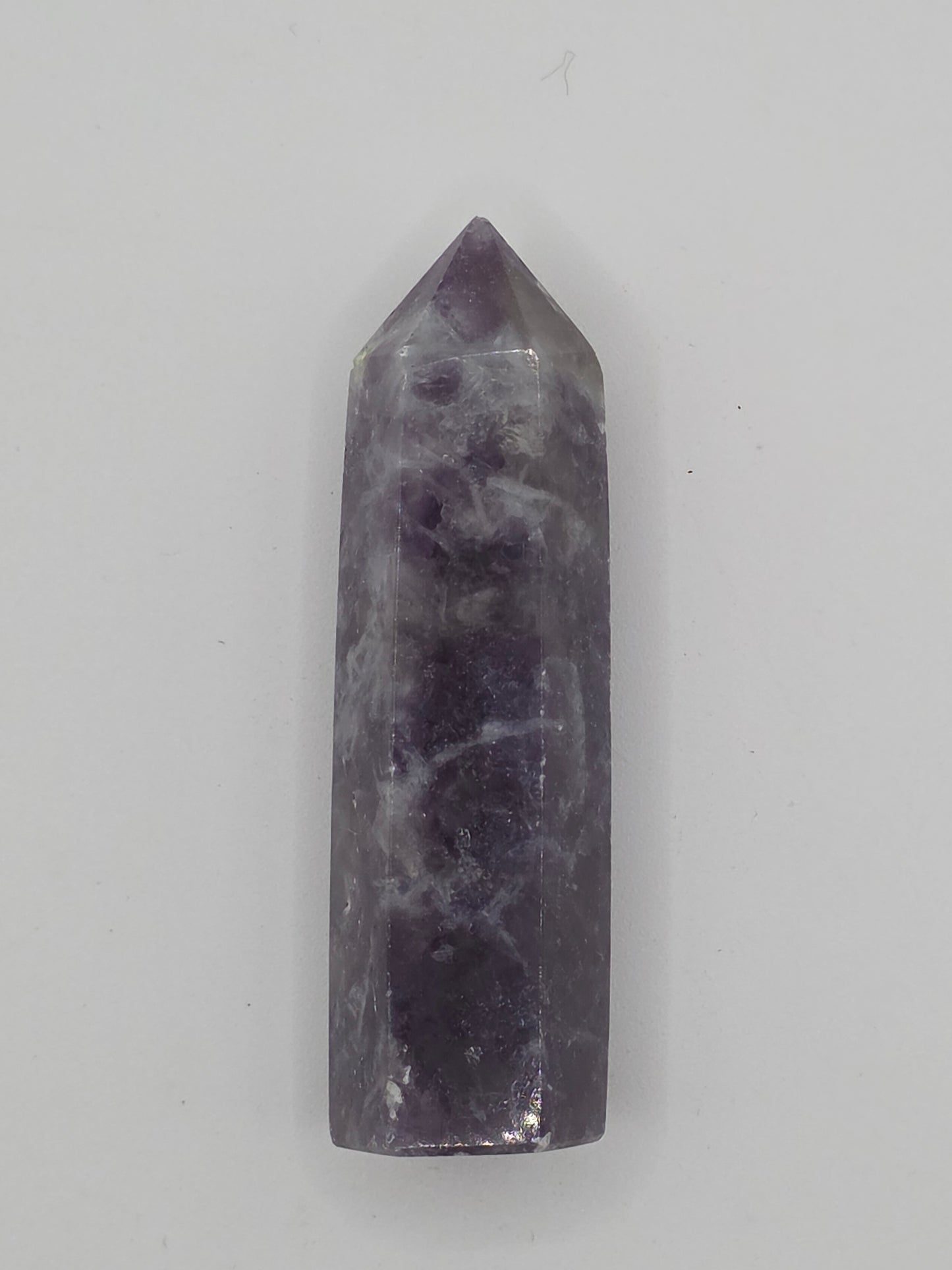 Alternate angle of Lepidolite tower showing reflective mica sparkle and smooth polish.