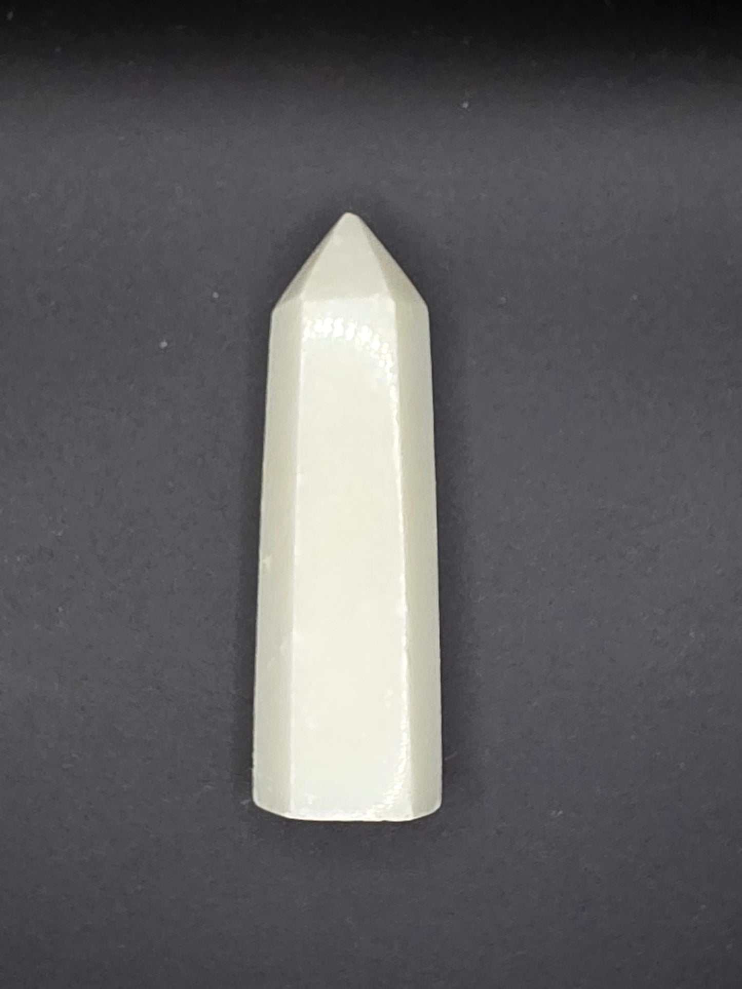 Alternate angle of White Calcite tower showing subtle glow and polished surface.