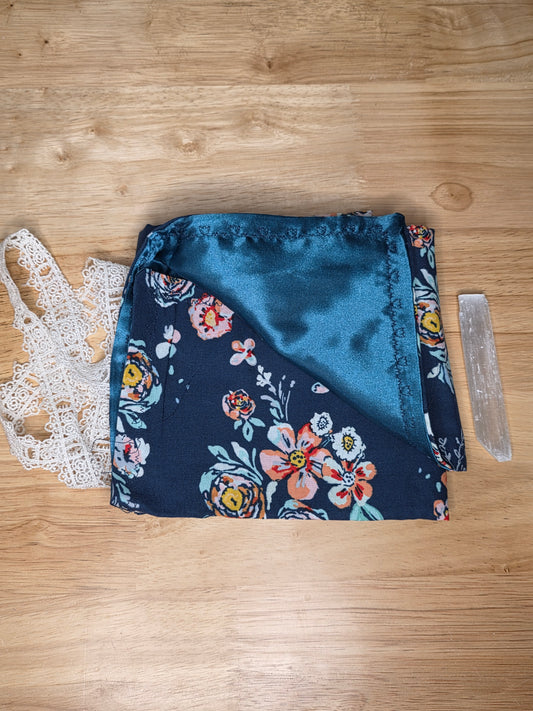 Handmade navy floral tarot wrap with navy satin lining and white lace tie, includes selenite stick.