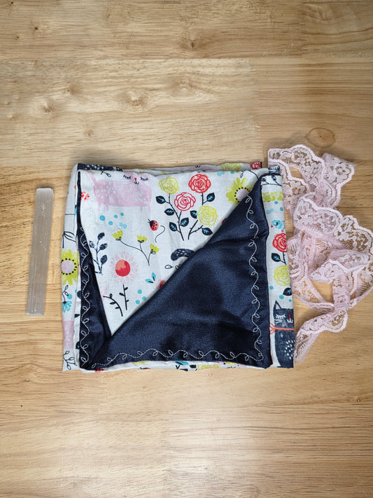Handmade floral tarot wrap with navy satin lining, pink lace tie, and included selenite stick for cleansing.