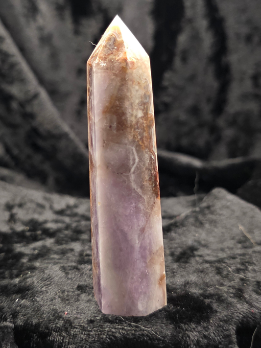 Amethyst & Crazy Lace Agate tower crystal point side view on dark background showing purple and brown banding
