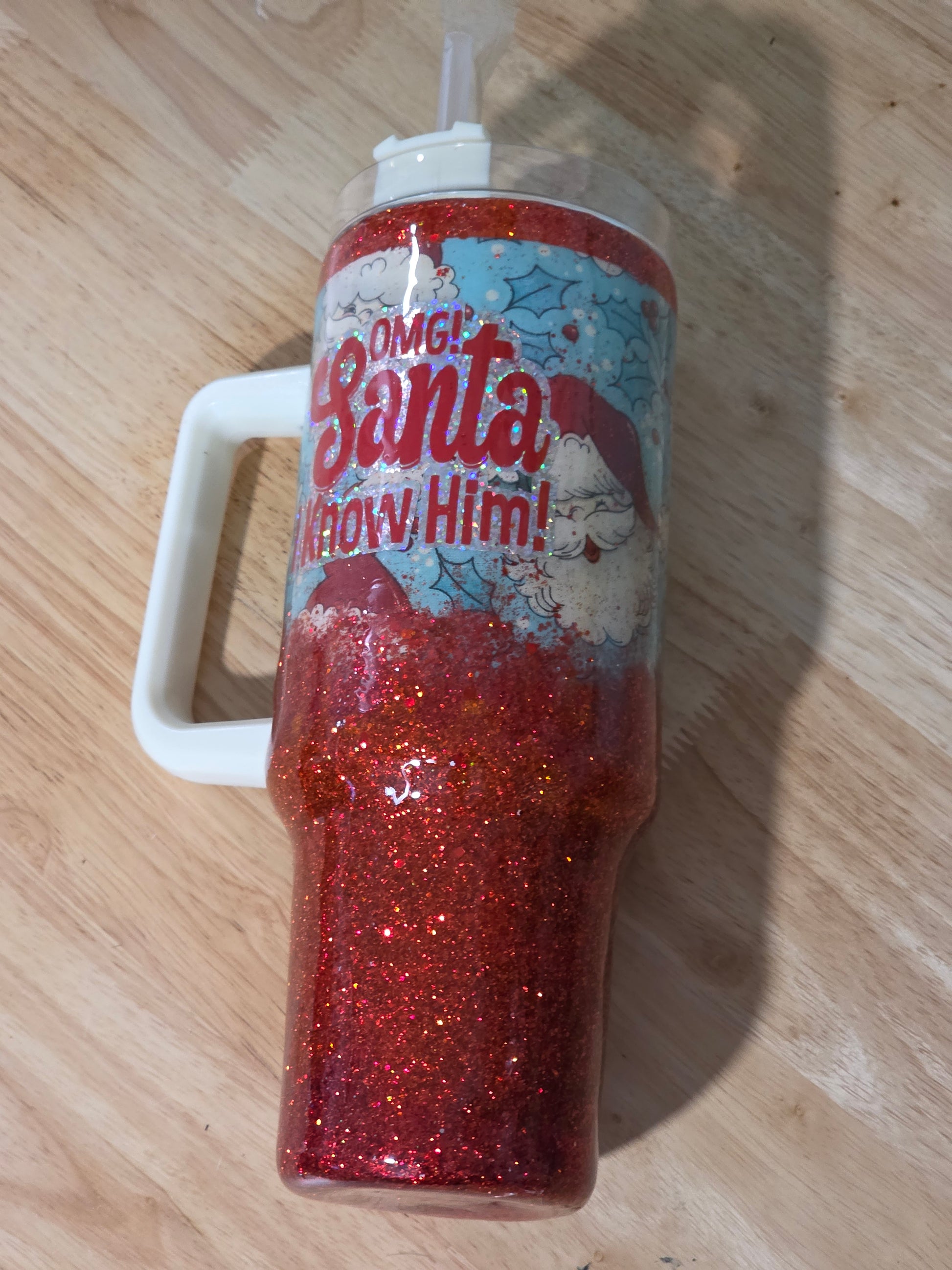 Side view of the Santa tumbler displaying the holographic vinyl text reading OMG Santa I Know Him.