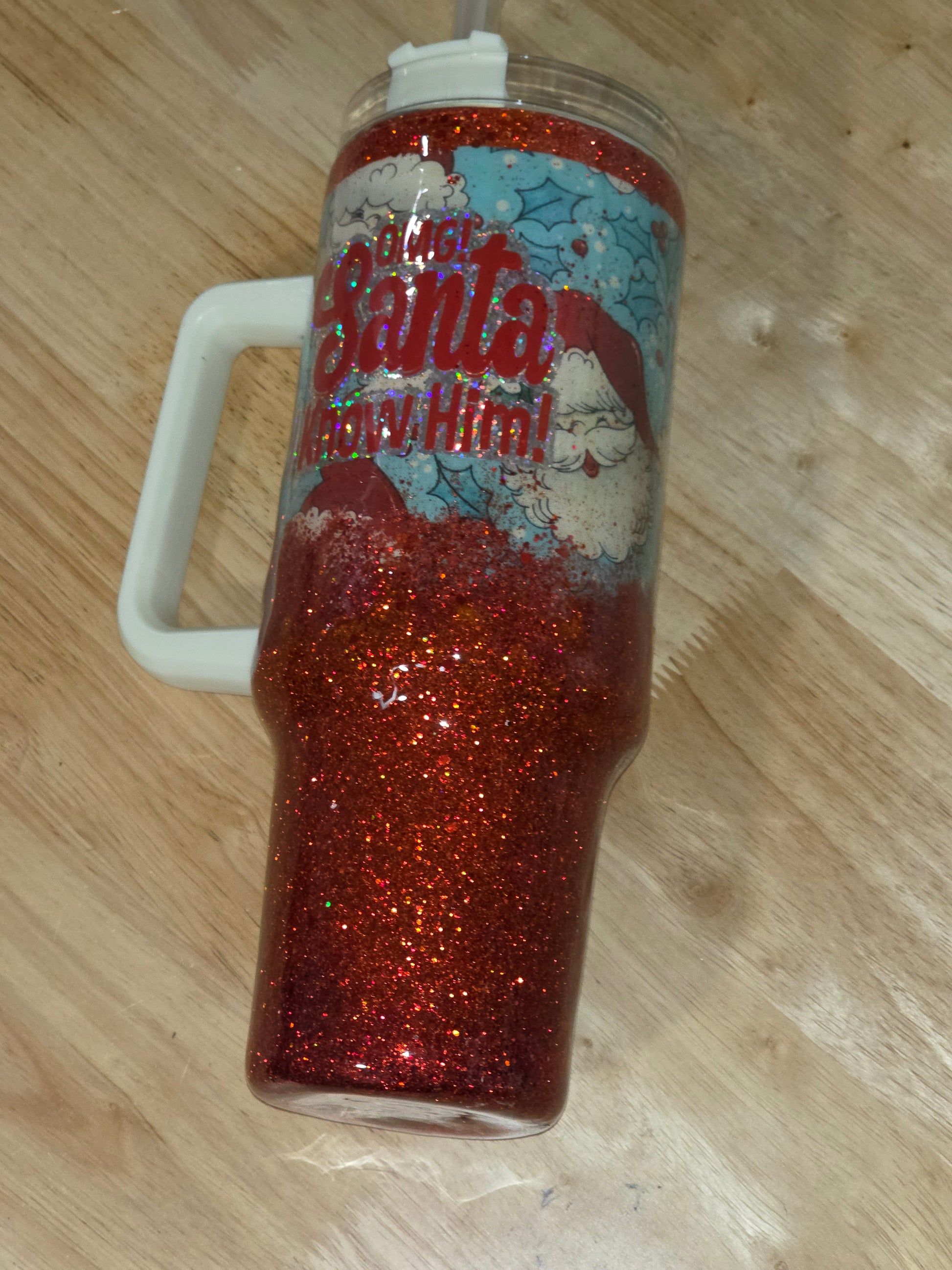 Full overhead angle showing the tumbler, handle, and vinyl design in soft lighting.