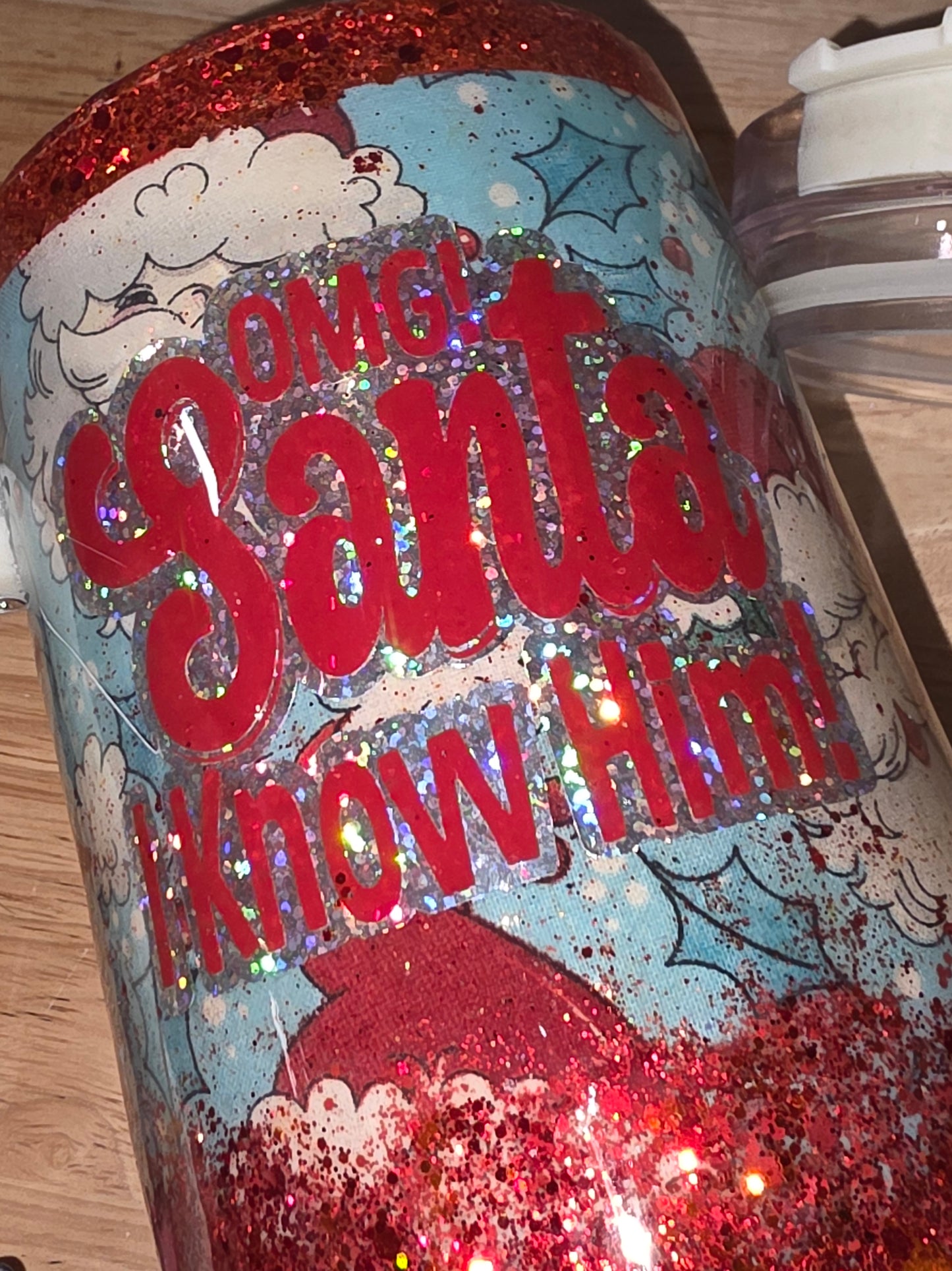 Bright close-up of the vinyl decal and red glitter ombré under direct light.