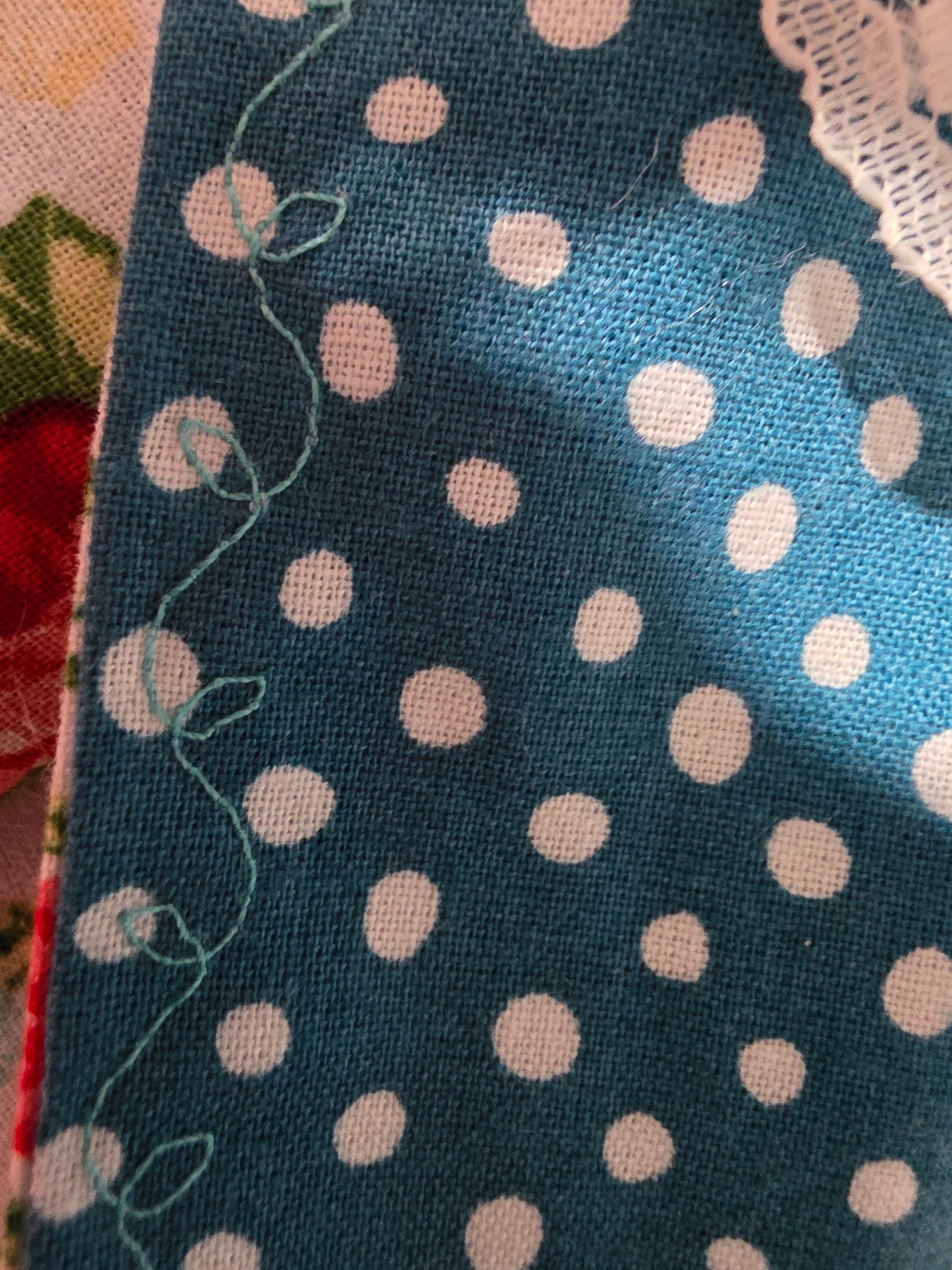 Reversible rose-pattern tarot wrap with teal polka dot fabric, ivory lace tie, and selenite stick.