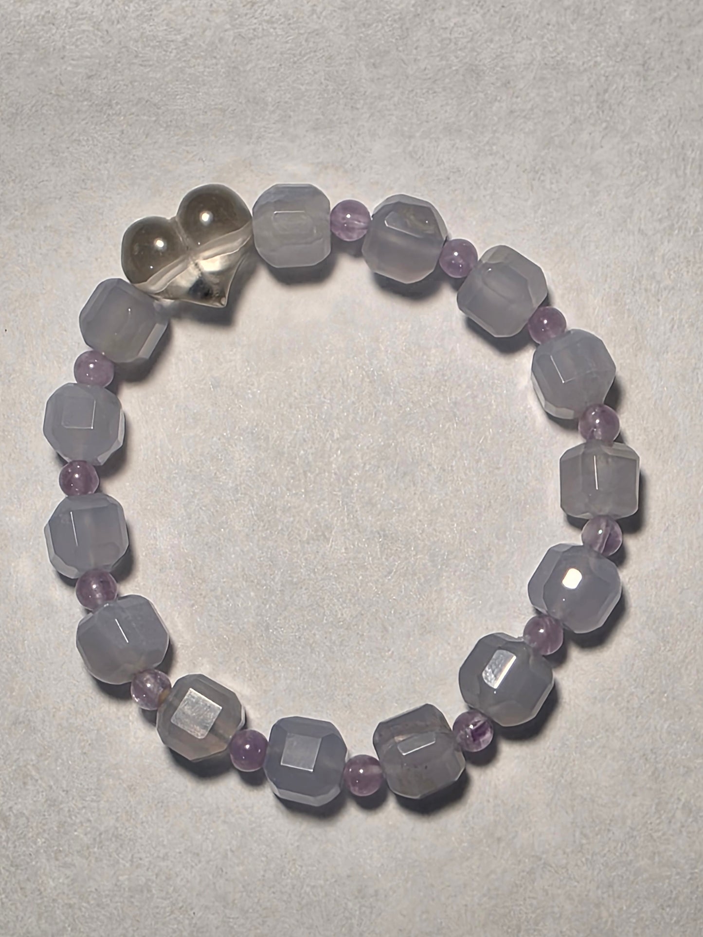 Blue Lace Agate and Amethyst cube-cut bracelet with Clear Quartz heart accent, shown on a white background.