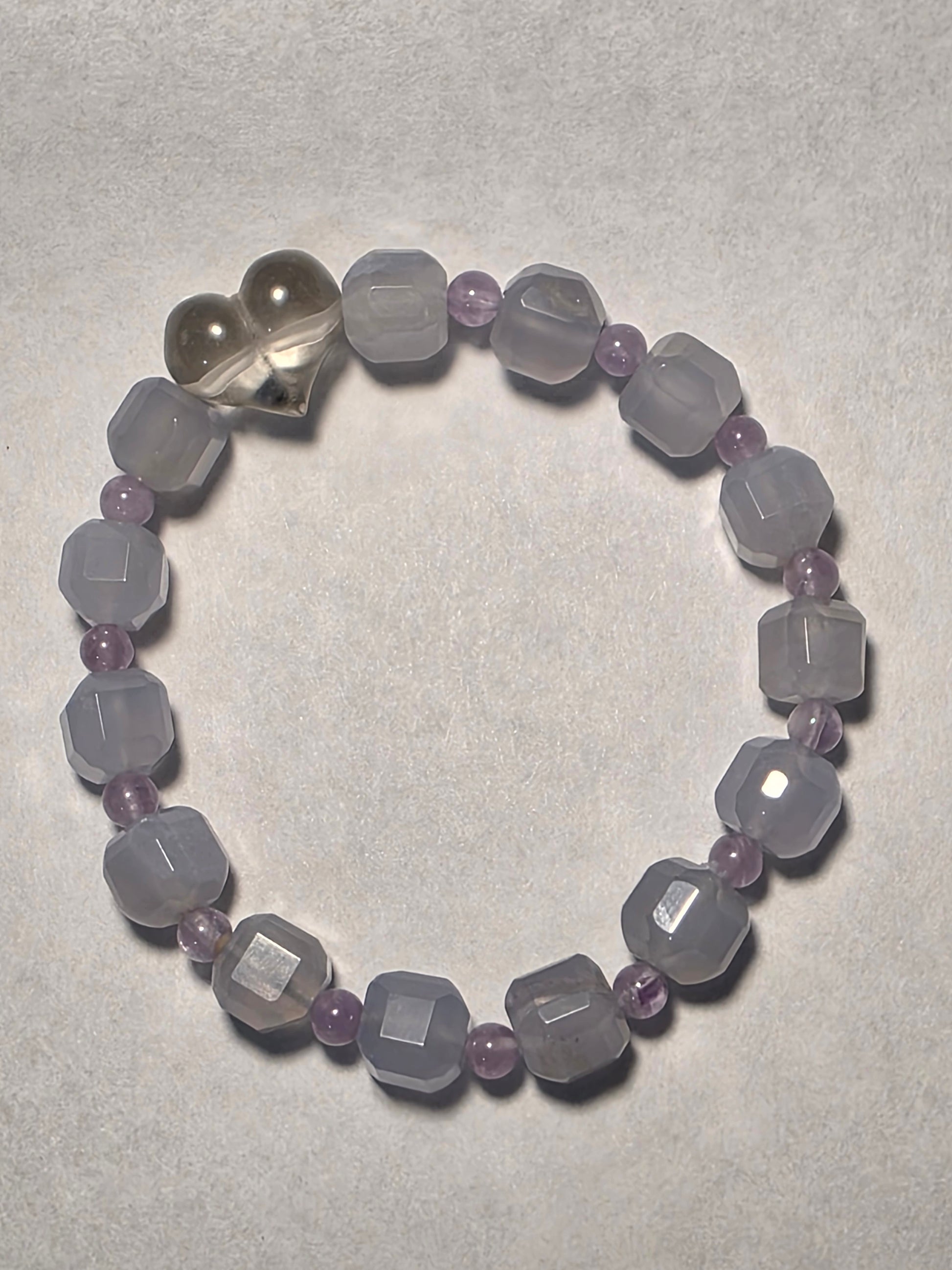 Blue Lace Agate and Amethyst cube-cut bracelet with Clear Quartz heart accent, shown on a white background.