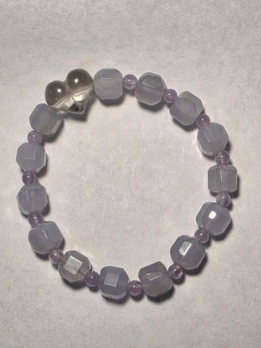 Blue Lace Agate and Amethyst cube-cut bracelet with Clear Quartz heart accent, shown on a white background.