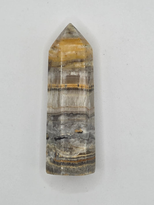 Golden and gray Bumblebee Jasper crystal tower, 2.56 inches tall, with vivid layered bands symbolizing courage and grounding.