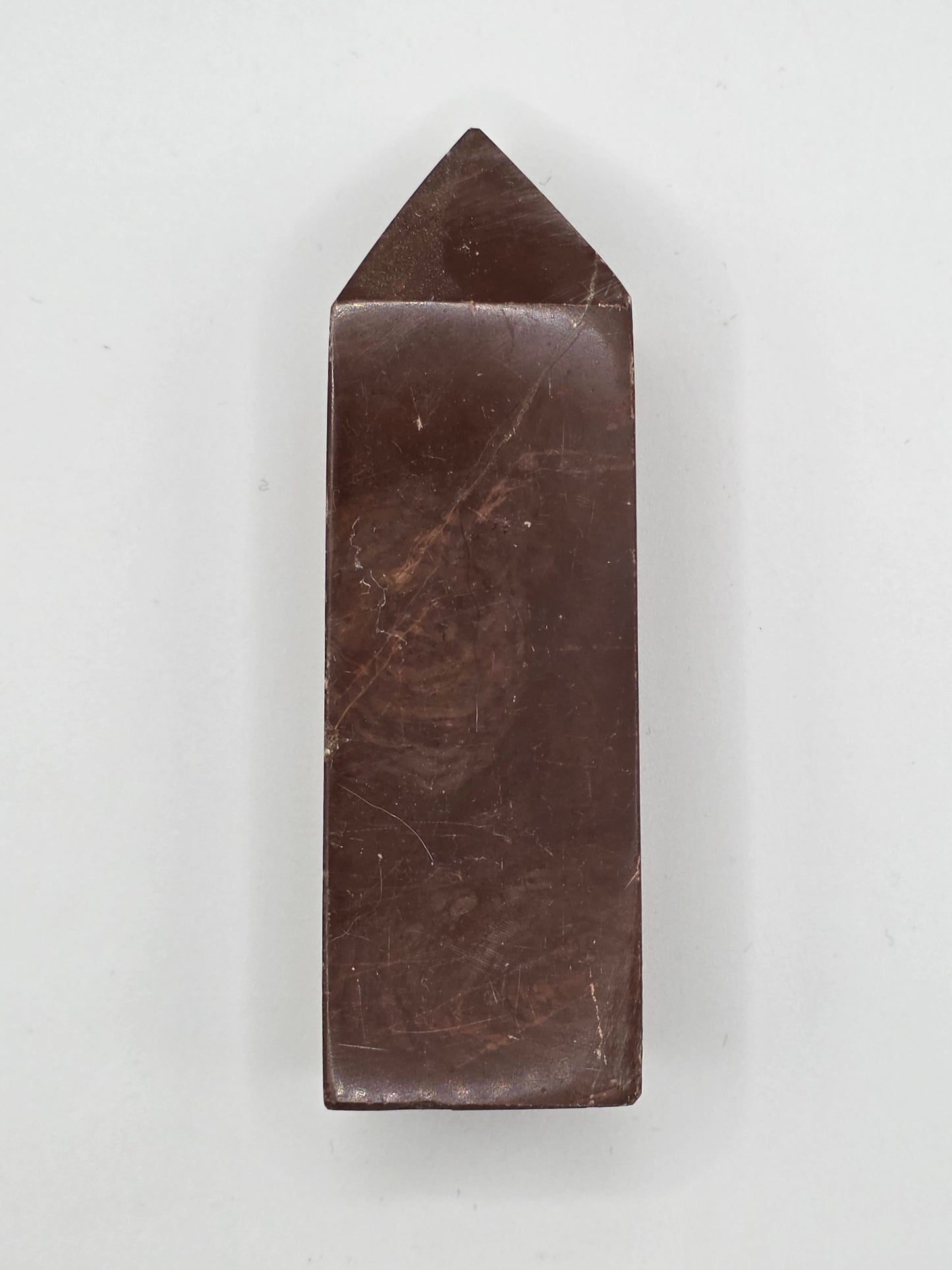 Chocolate Jasper tower with deep brown hue and subtle marbled texture, standing upright on white background.