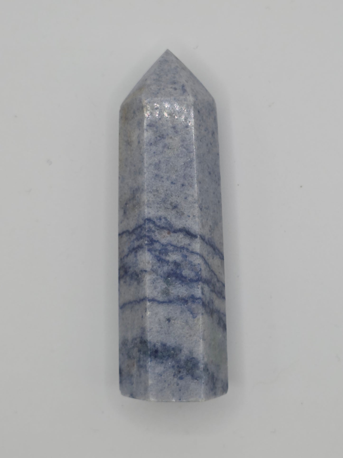 Angled view of Dumortierite tower showing wavy blue patterns and smooth polish.