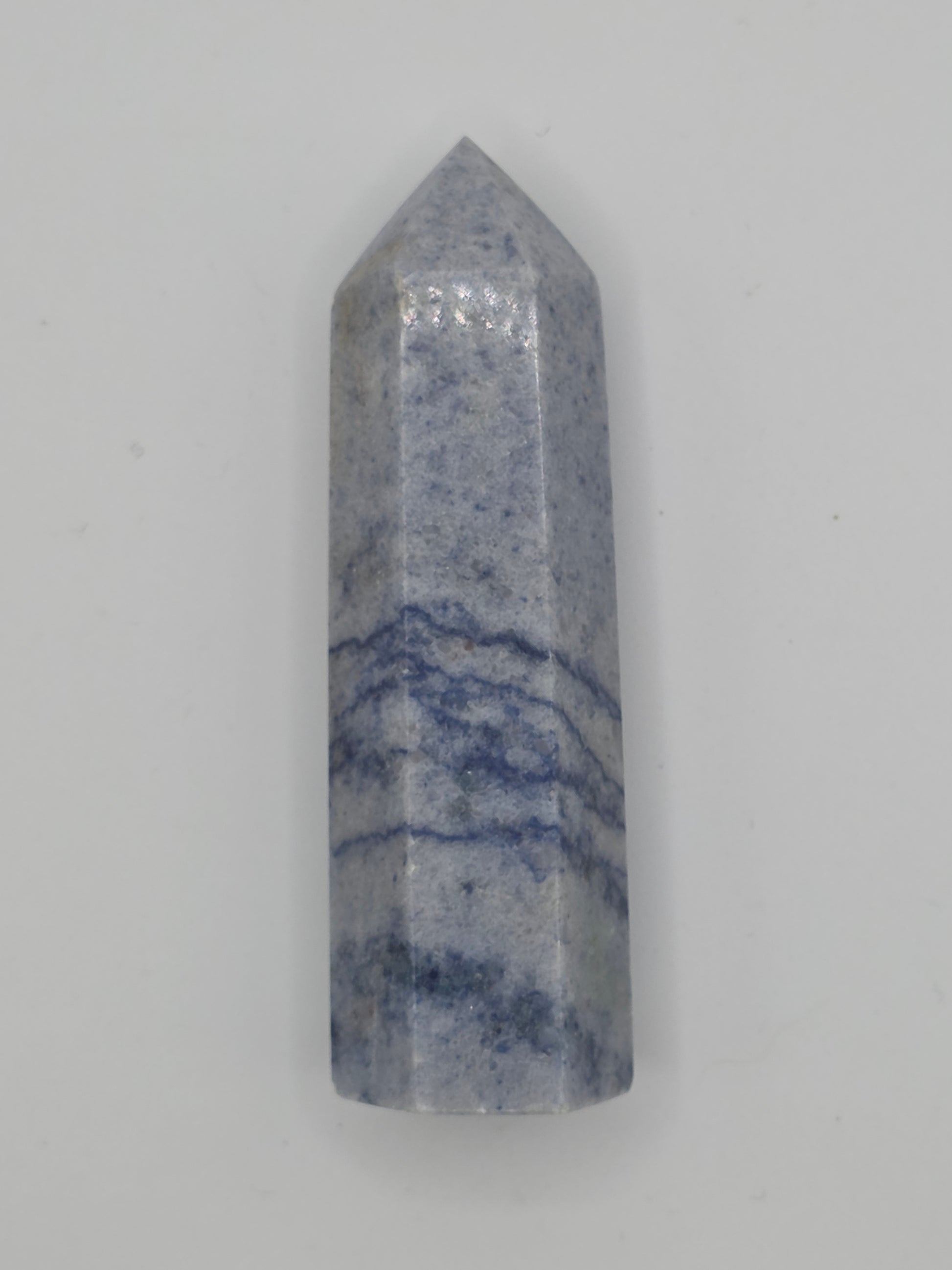 Angled view of Dumortierite tower showing wavy blue patterns and smooth polish.
