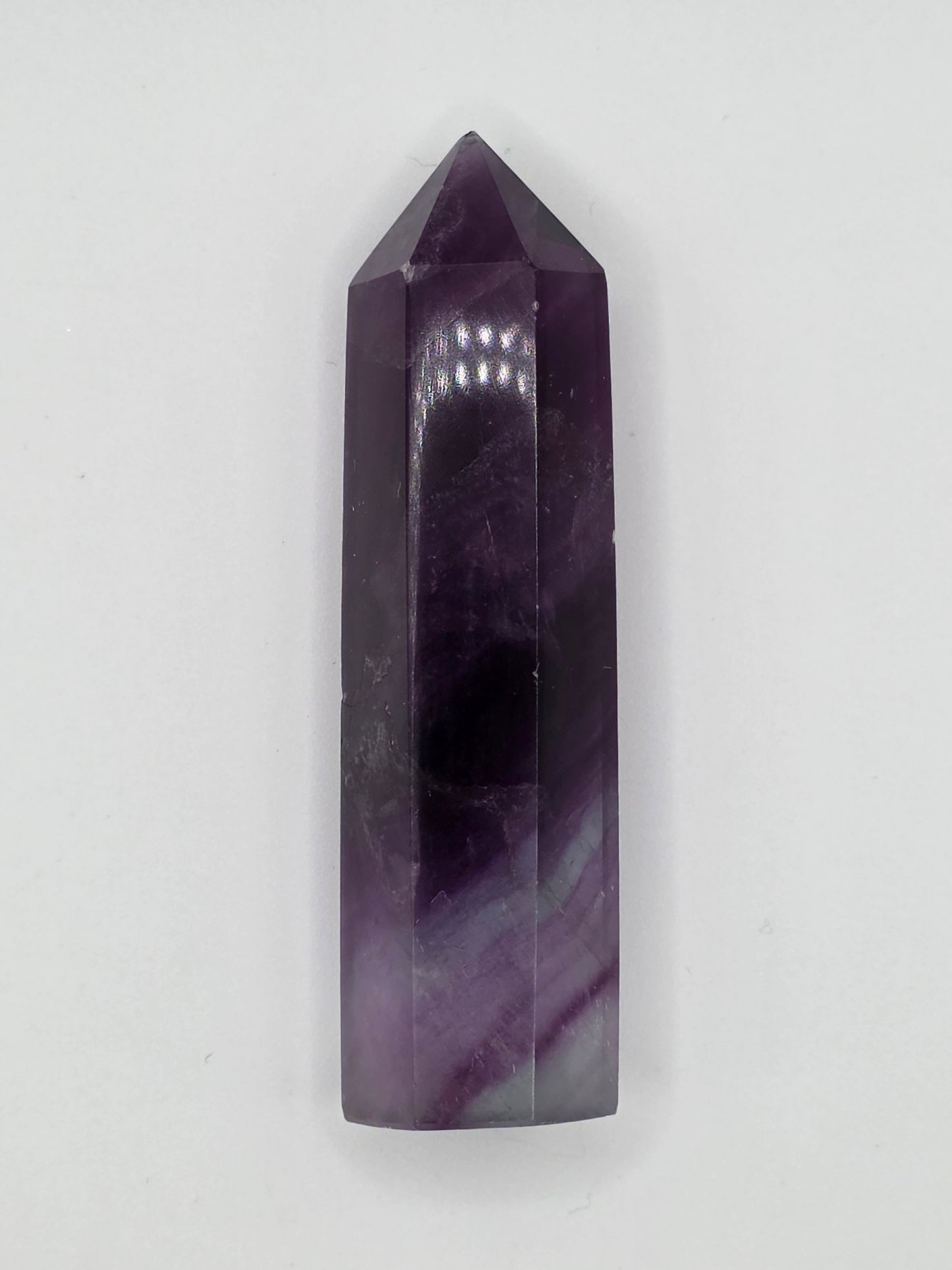 Alternate angle of Fluorite tower showing layered purple gradients and polished surface.
