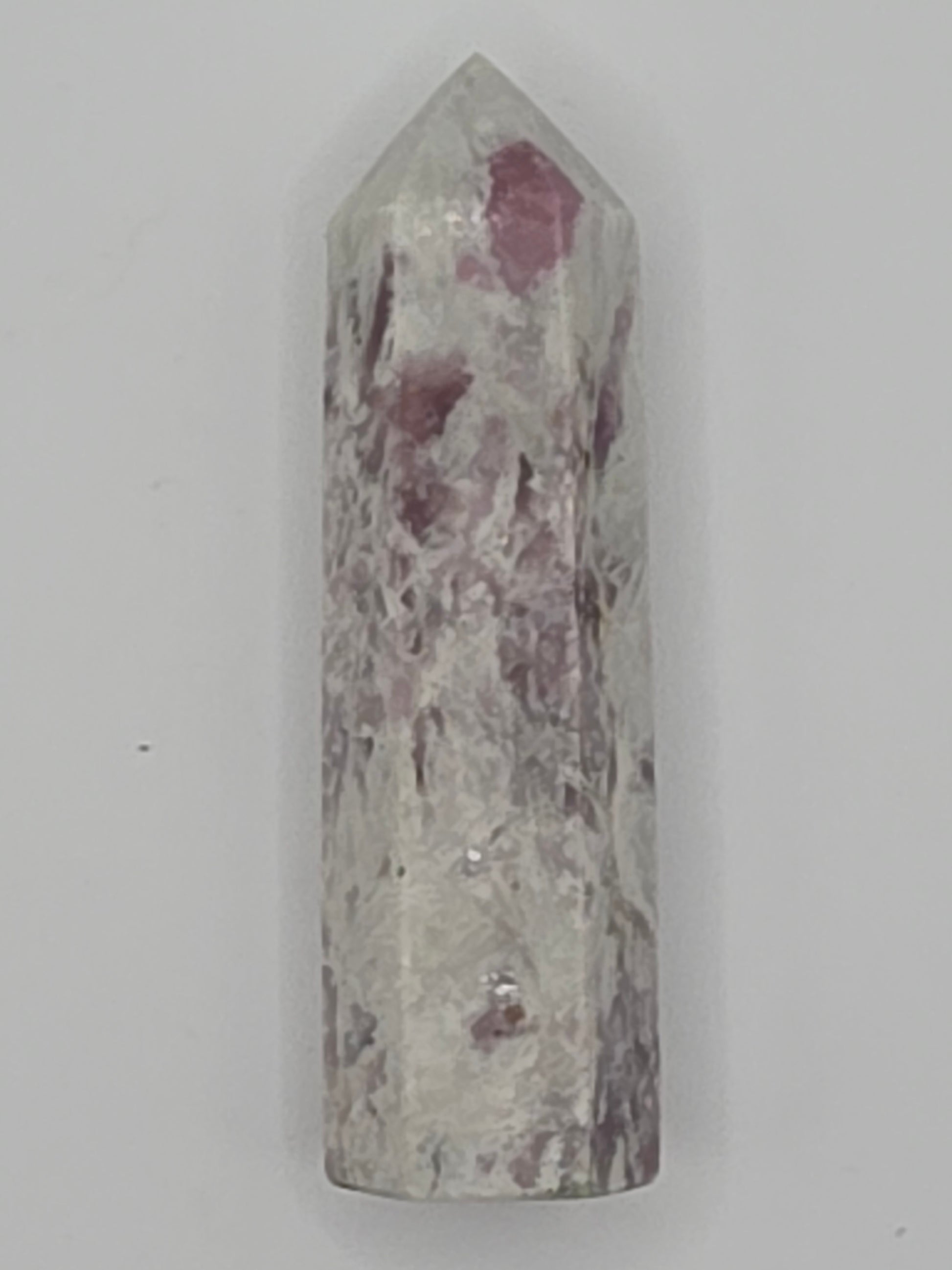 Pink Lepidolite tower with lilac and rose mica shimmer on white background.