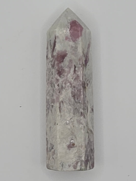 Pink Lepidolite tower with lilac and rose mica shimmer on white background.
