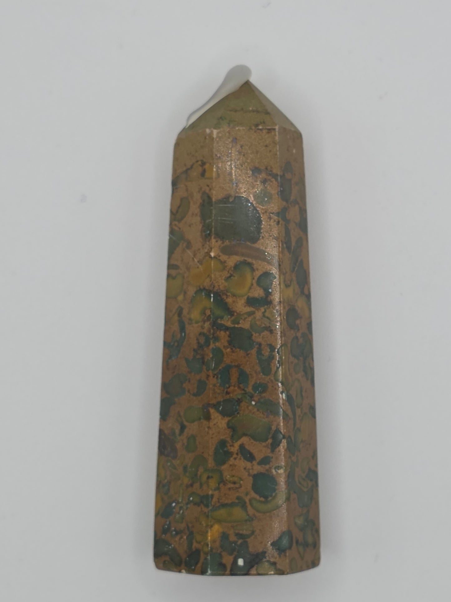 Rainforest Jasper tower with green, gold, and brown mottled pattern on white background.