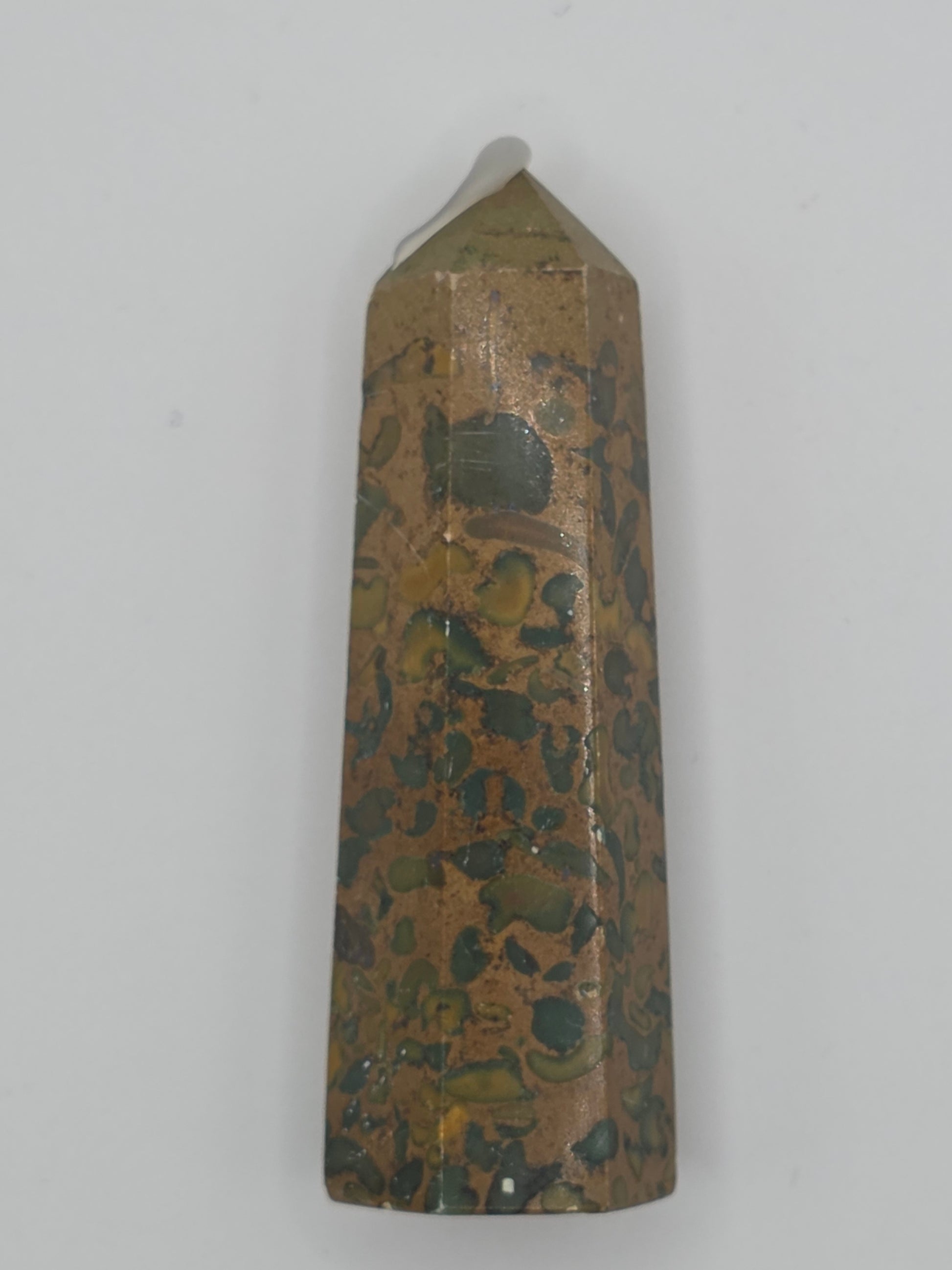 Rainforest Jasper tower with green, gold, and brown mottled pattern on white background.