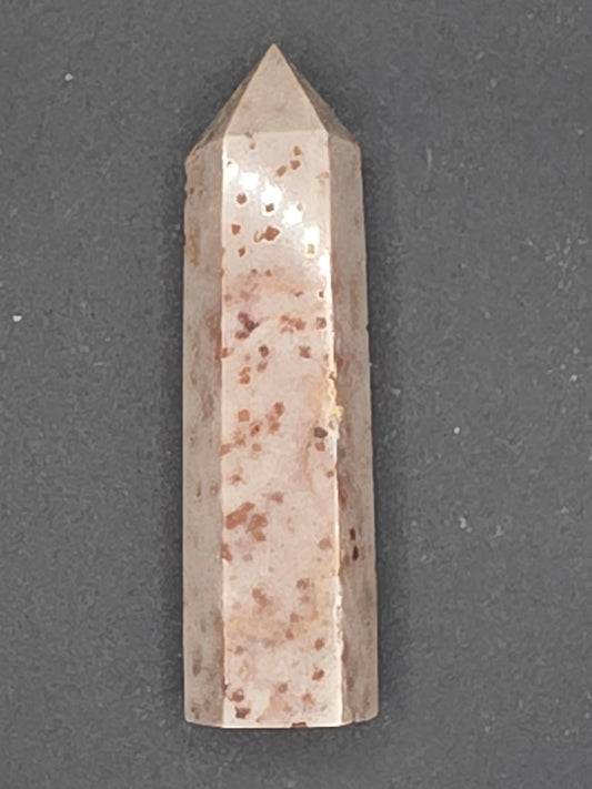 Soft peach Sunstone (Aventurine Feldspar) crystal tower, 3.25 inches tall, with natural freckles and gentle sheen. Promotes grounded confidence and creativity.