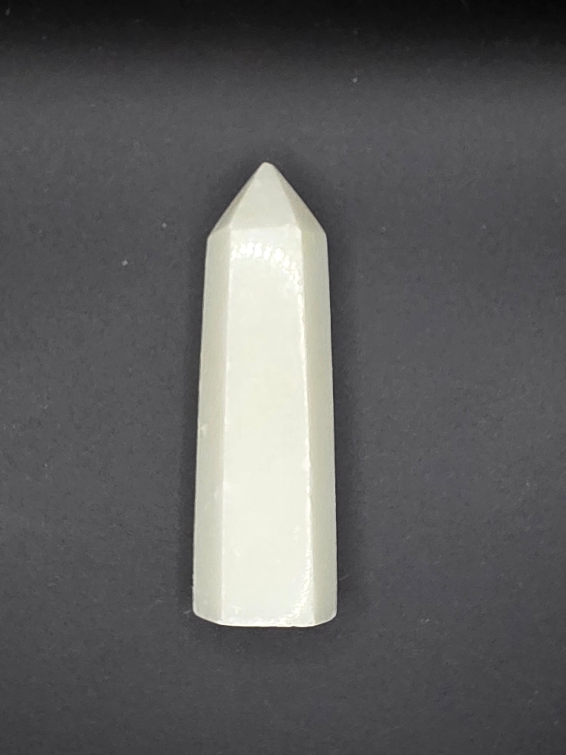 Alternate angle of White Calcite tower showing subtle glow and polished surface.